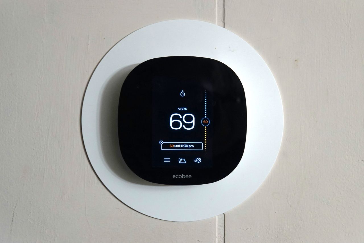 smart thermostat attached to wall