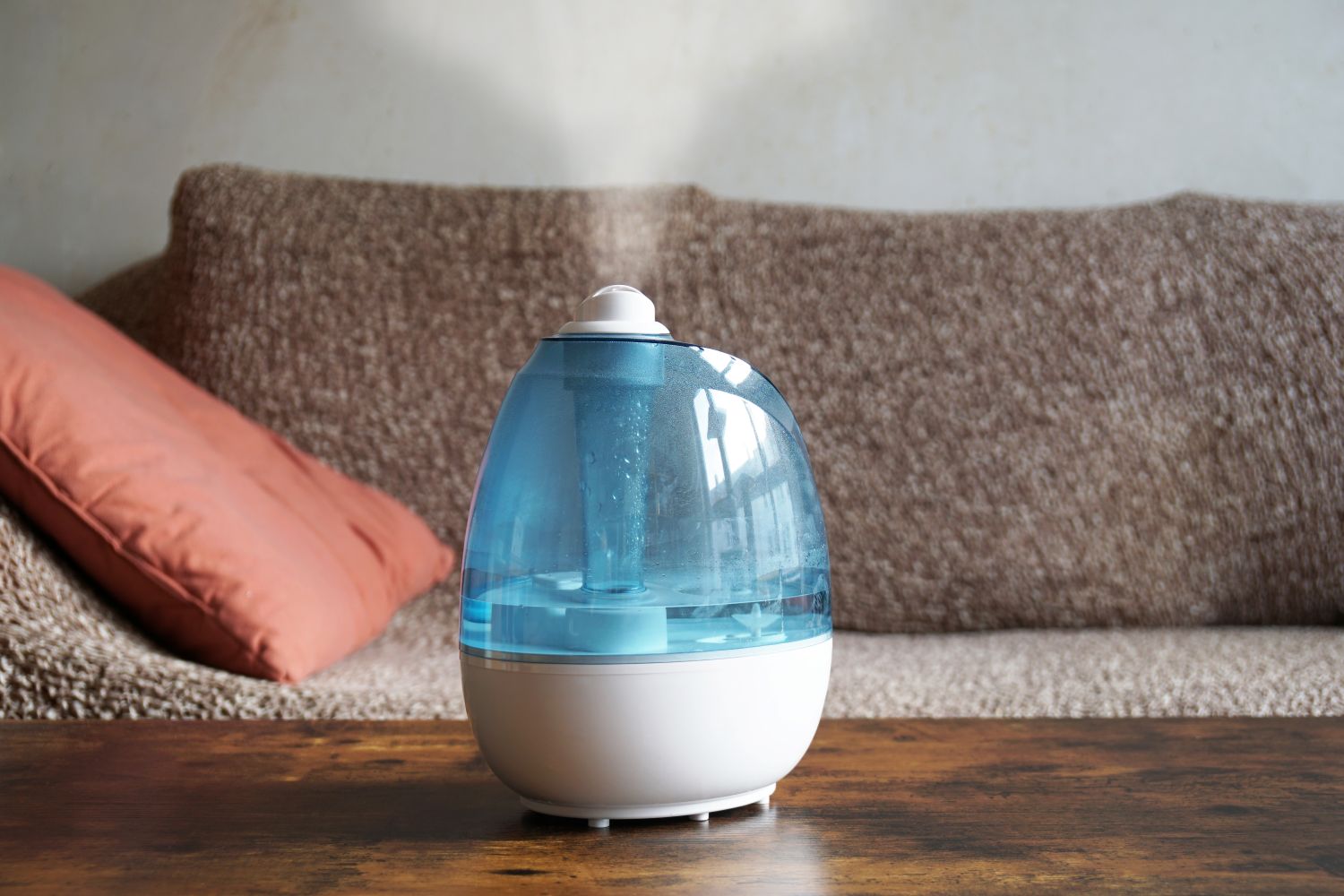 Portable humidifier on table in living room.