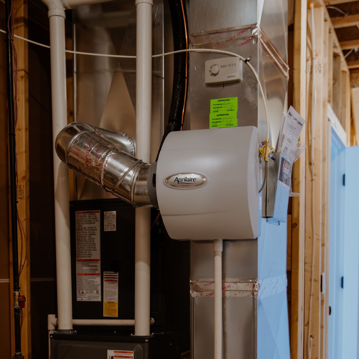 whole-home humidifier in house Whole-home humidifier inside a house.
